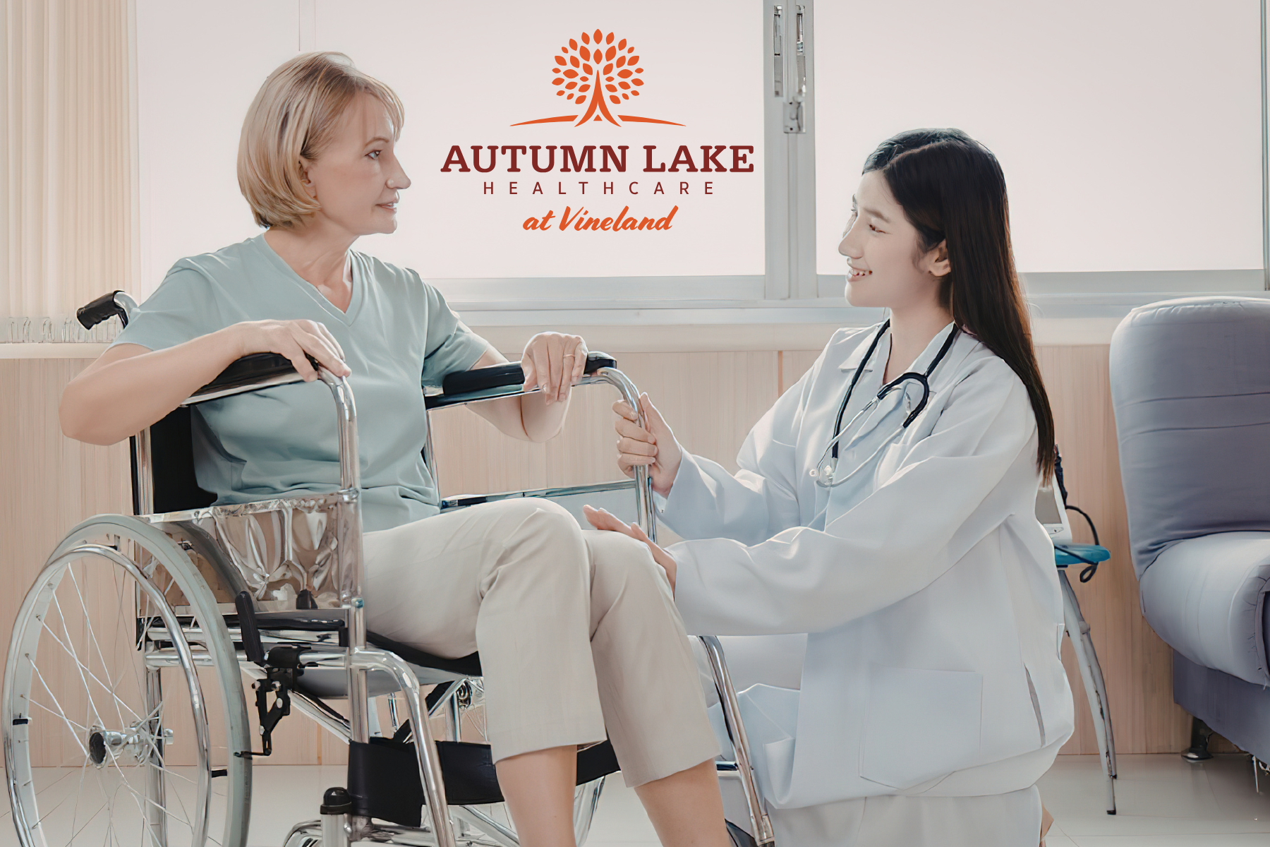 A young doctor in a lab coat is caring for an elderly woman in a wheelchair, with the Autumn Lake Healthcare at Vineland logo visible above them.